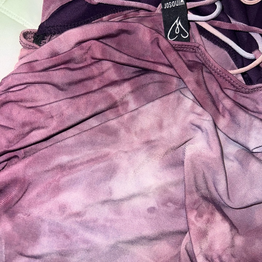Beautiful purplish, fitted to the body nicely . Condition new .